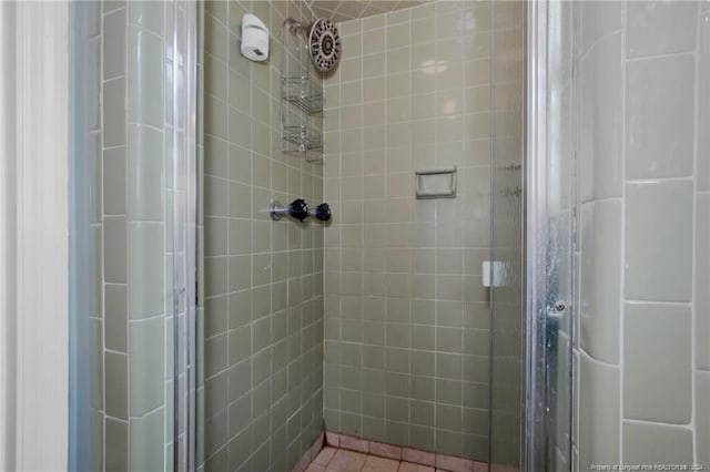 bathroom with a shower with shower door