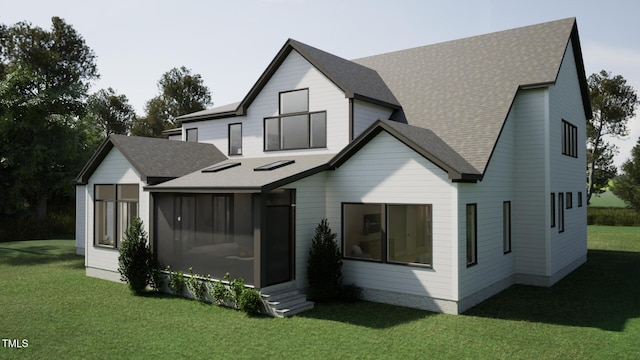 rear view of house with a shingled roof, a sunroom, and a lawn