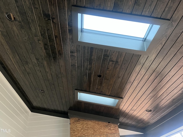 details with a skylight and wood ceiling