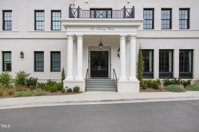 property entrance with brick siding