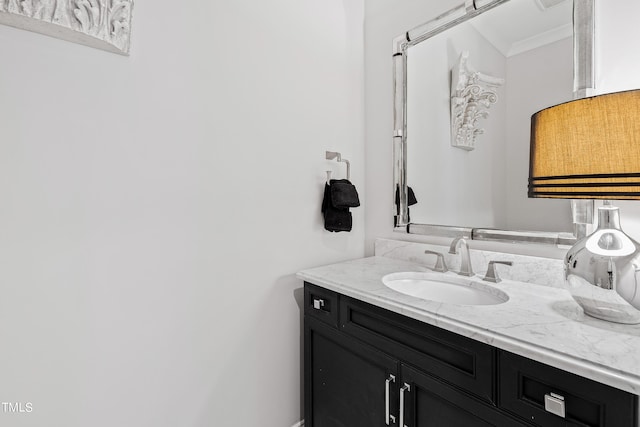 bathroom featuring vanity and crown molding