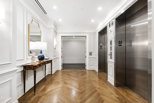hallway with recessed lighting, elevator, a decorative wall, and crown molding
