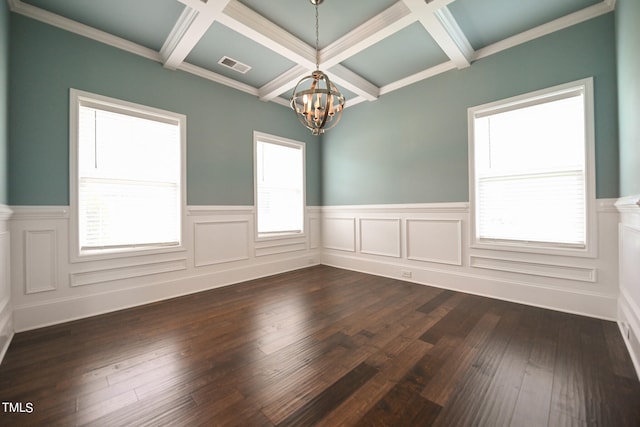 empty room with coffered ceiling, hardwood / wood-style floors, and plenty of natural light