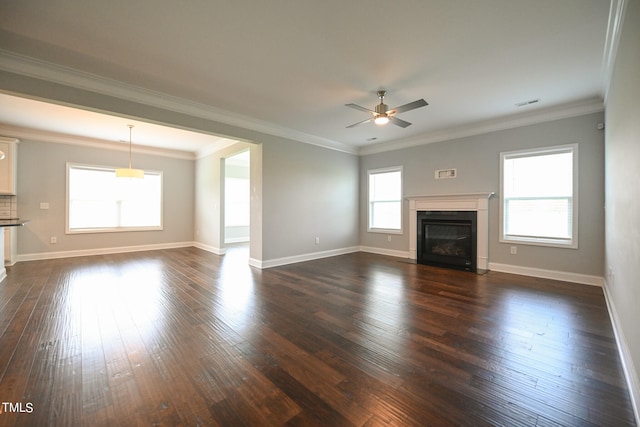 unfurnished living room with crown molding, dark hardwood / wood-style flooring, and ceiling fan