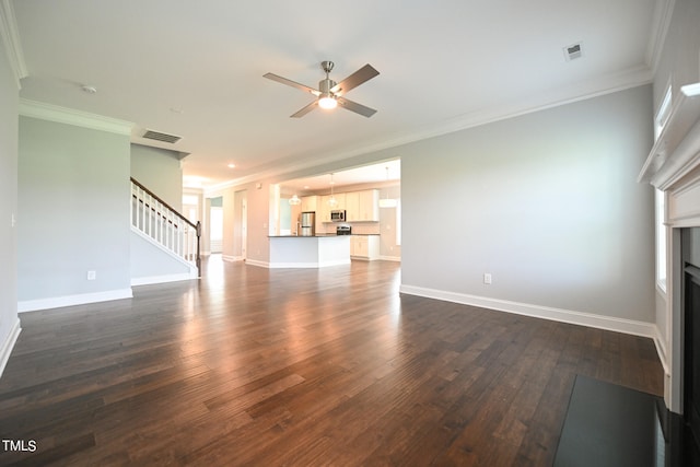 unfurnished living room featuring wood-type flooring, crown molding, and ceiling fan