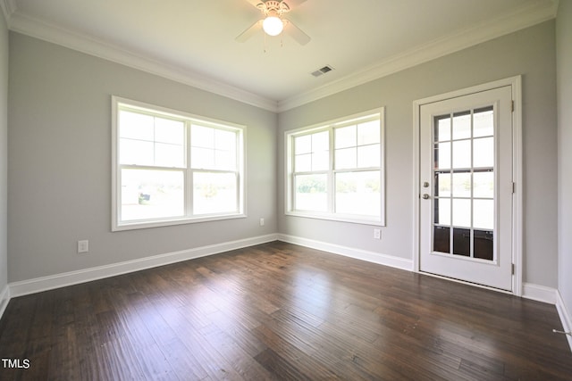 spare room with crown molding, dark hardwood / wood-style floors, and ceiling fan