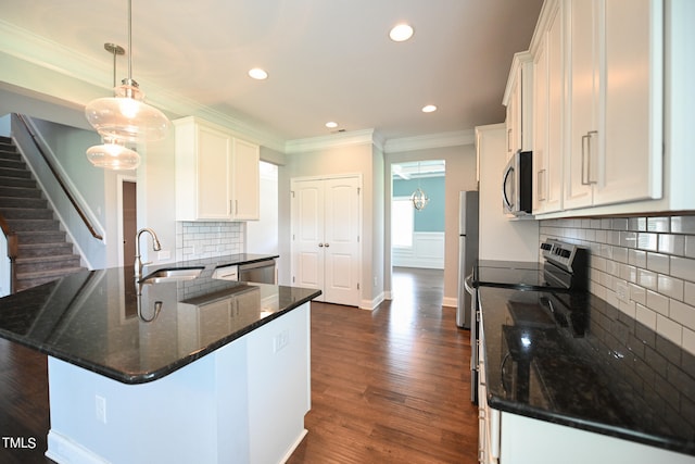 kitchen with sink, decorative backsplash, dark hardwood / wood-style floors, and stainless steel appliances