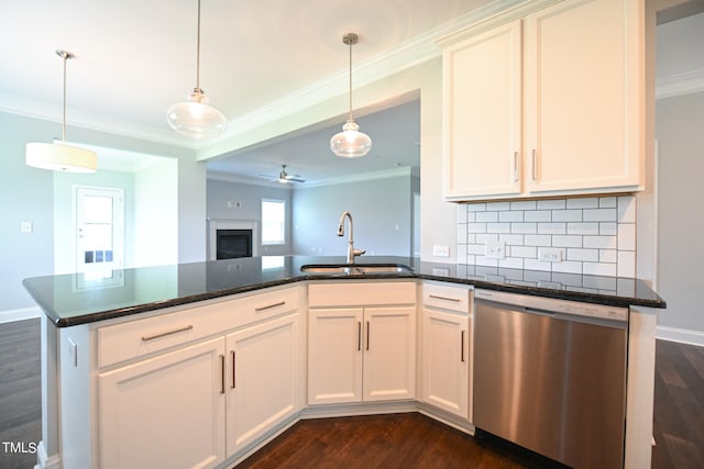 kitchen with dishwasher, crown molding, sink, and dark wood-type flooring