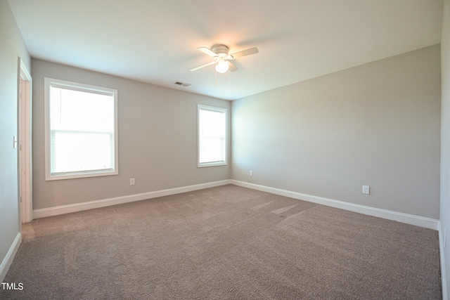 unfurnished room featuring carpet floors and ceiling fan