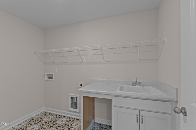 washroom with washer hookup, sink, cabinets, and hookup for an electric dryer