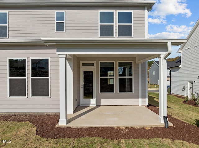 entrance to property with a patio area