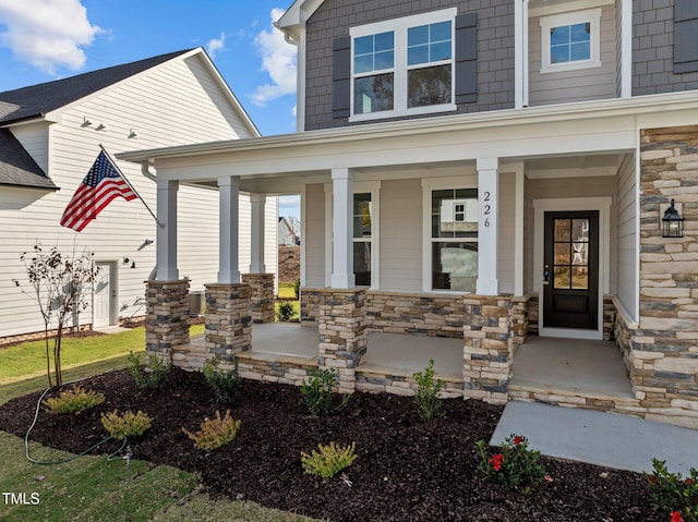 property entrance with covered porch