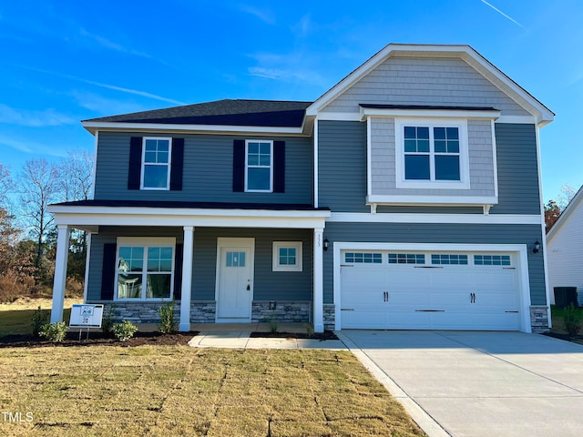 view of front of house featuring a garage, a porch, central air condition unit, and a front lawn