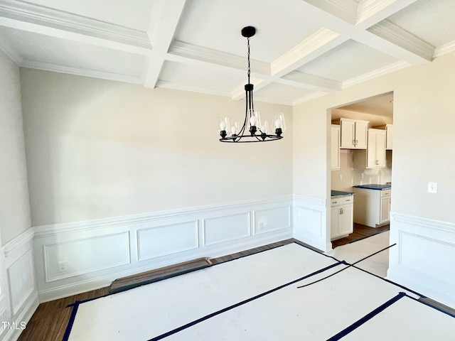 unfurnished dining area featuring beamed ceiling, light hardwood / wood-style floors, and a chandelier