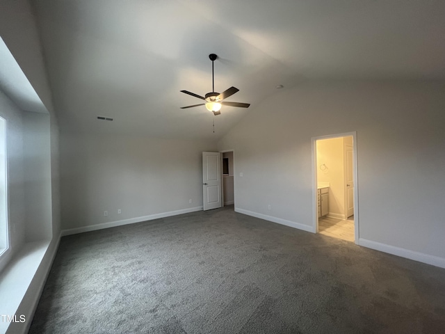 carpeted empty room featuring lofted ceiling and ceiling fan