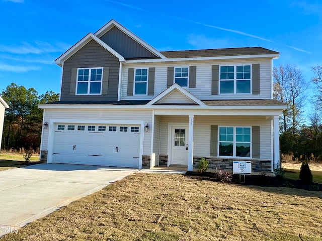 craftsman-style house with a garage and a front yard