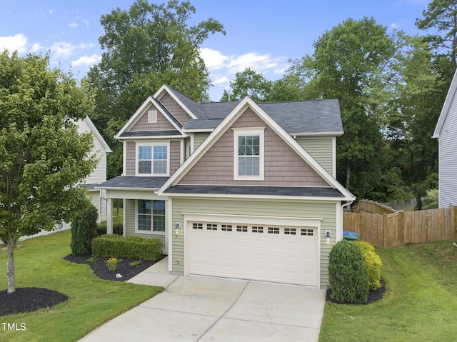 craftsman house featuring a front lawn and a garage