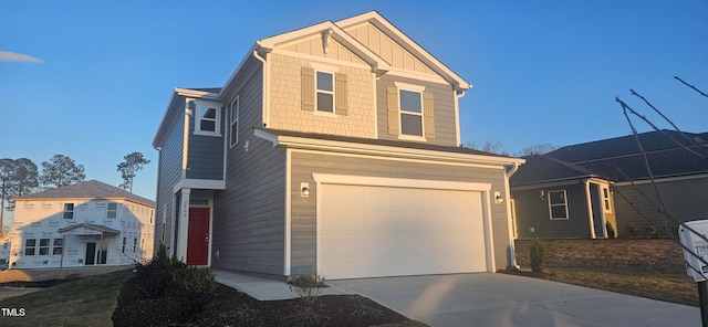 view of front of property featuring a garage, concrete driveway, and board and batten siding