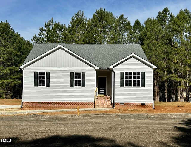 view of front of house featuring crawl space and roof with shingles