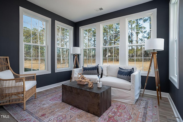 sunroom / solarium featuring visible vents