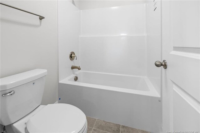 bathroom featuring tile patterned flooring and toilet