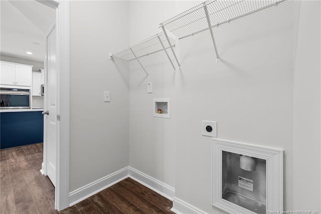 clothes washing area featuring electric dryer hookup, dark wood-type flooring, and washer hookup