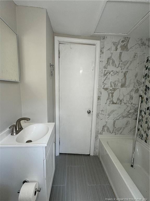bathroom featuring vanity and bathing tub / shower combination