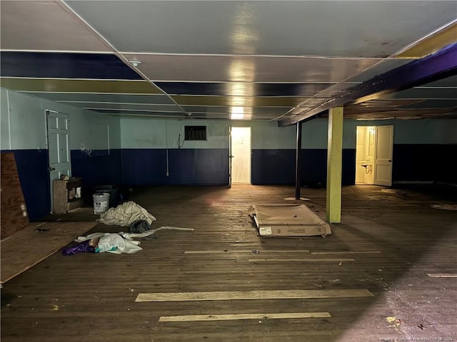 below grade area with wood-type flooring