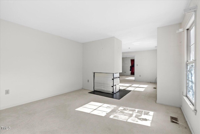 unfurnished room with light colored carpet