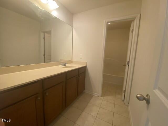 bathroom with vanity and tile patterned floors