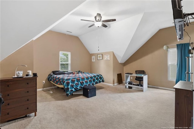 carpeted bedroom with ceiling fan and lofted ceiling