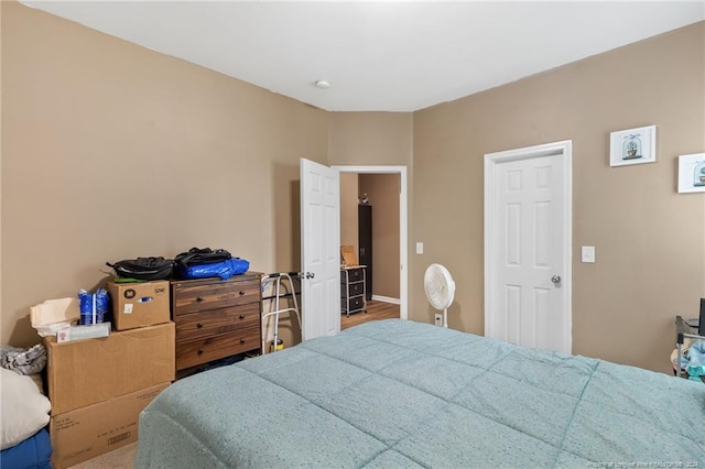 bedroom with hardwood / wood-style floors