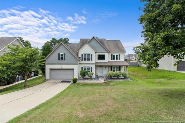 view of front of house featuring concrete driveway, a front lawn, and an attached garage