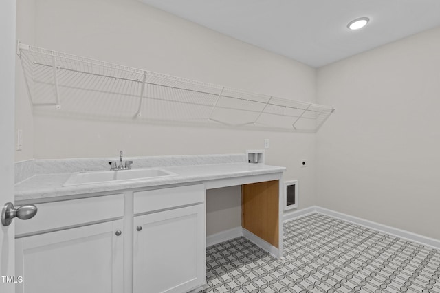 laundry area featuring electric dryer hookup, sink, and hookup for a washing machine