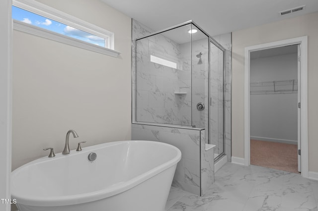 bathroom with separate shower and tub