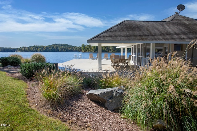 view of pool with a water view