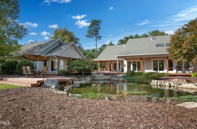 rear view of house with a patio and a deck