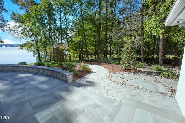 view of patio / terrace featuring a water view