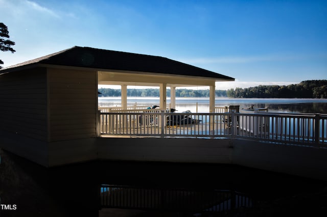 exterior space featuring a gazebo and a water view