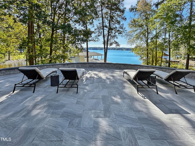 view of patio with a water view