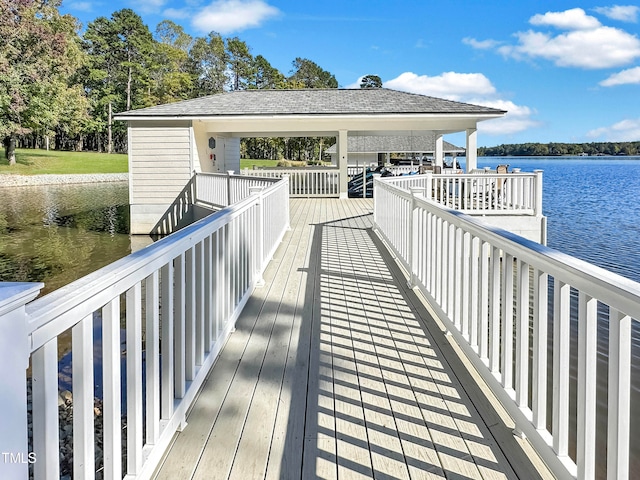 dock area featuring a deck with water view