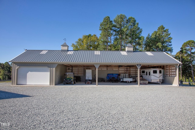 view of front facade featuring a garage and a carport