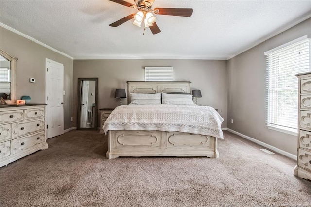 carpeted bedroom with crown molding and ceiling fan