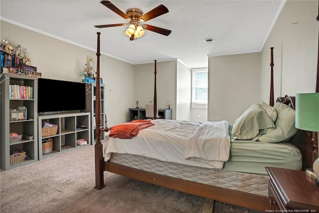 bedroom featuring ornamental molding, carpet floors, a textured ceiling, and ceiling fan