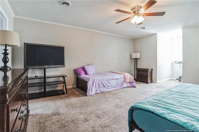 carpeted bedroom featuring a textured ceiling, ornamental molding, and ceiling fan