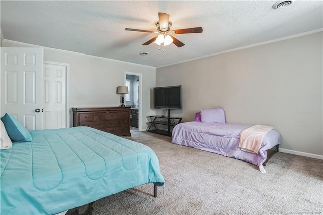 bedroom featuring ornamental molding, a textured ceiling, ceiling fan, and carpet flooring