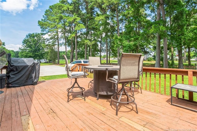 wooden deck featuring grilling area