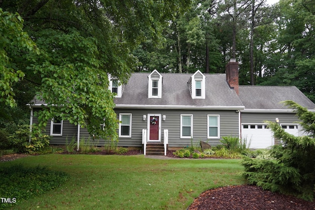 cape cod house featuring a front yard and a garage