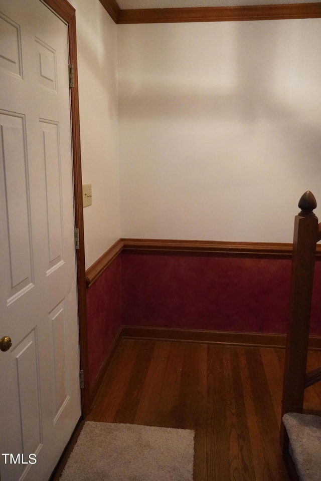 interior space with crown molding and dark hardwood / wood-style flooring