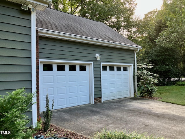 garage featuring wood walls